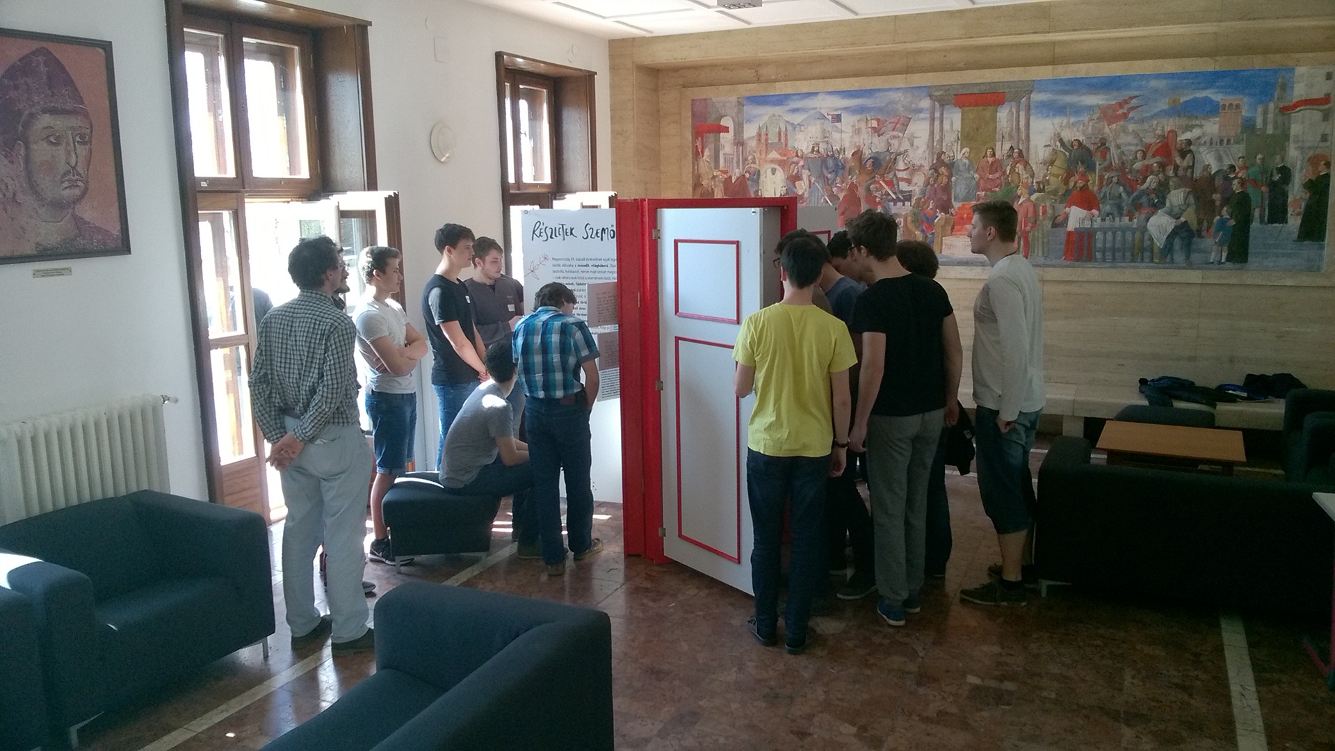 high-school students standing around the doors of the exhibition
